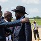 South Sudan President Salva Kiir (R) has pledged that his government will respect a tenuous peace agreement for the country