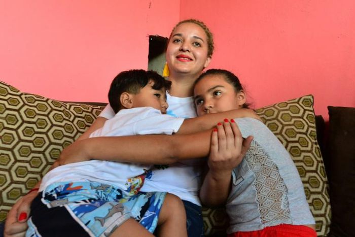 Ruth Elizabeth Gomez left her children Dorian (left), 5, and Alejandra, 8, behind in Honduras when she attempted to emigrate to the United States, only to be deported home