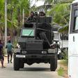 Soldiers patrol in Kalmunai where three suicide bombers blew themselves up during a raid by troops and police on Friday