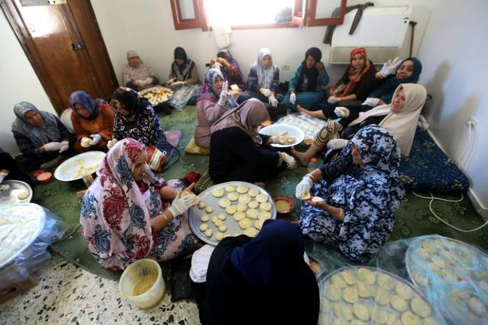 Women prepare Iftar meals for fighters from Libya's Government of National Accord (GNA) in Misrata, 200 kilometres (120 miles) from the fighting in the southern outskirts of the capital Tripoli