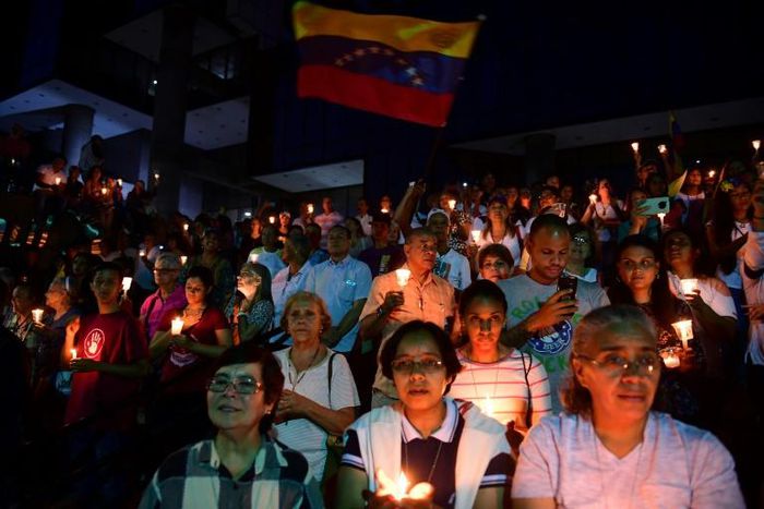Anti-government demonstrators gather during a day of vigils and prayers called by Venezuelan opposition leader and self-proclaimed interim president Juan Guaido on May 5, 2019