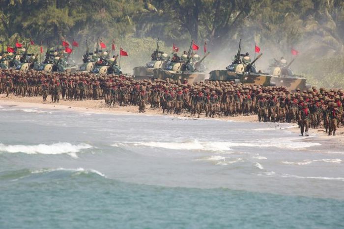 Myanmar troops and tanks move in formation along the shore during the second day of the 'Sin Phyu Shin' joint military exercises in Ayeyarwaddy delta region in 2018
