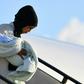 A Libyan mother and child disembark at the Pratica di Mare military airport, on the outskirts of Rome