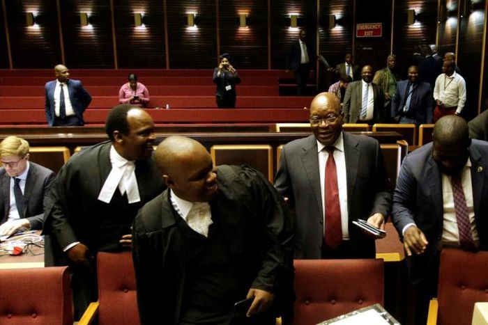 Zuma (second R) told supporters outside the court he has had to sell hats and socks to pay legal fees