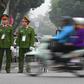 On guard: Vietnam police on duty in Hanoi