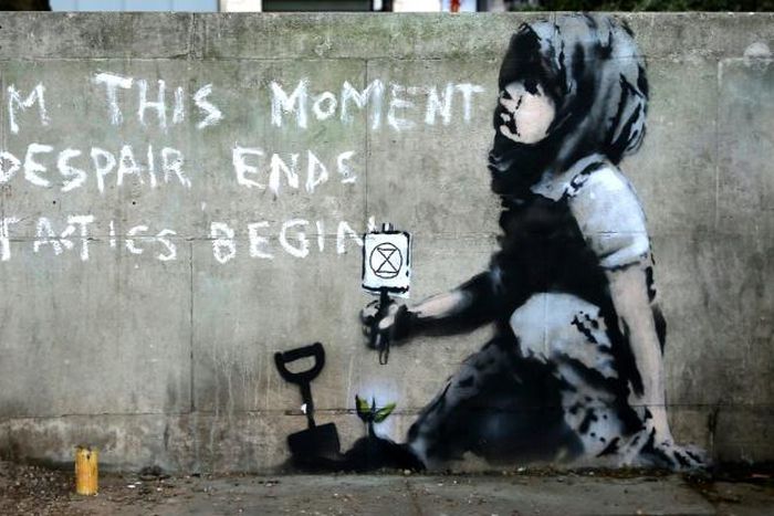 The graffiti artwork near Marble Arch, widely believed to be the work of street artist Banksy, captures the essence of the Extinction Rebellion climate change protest