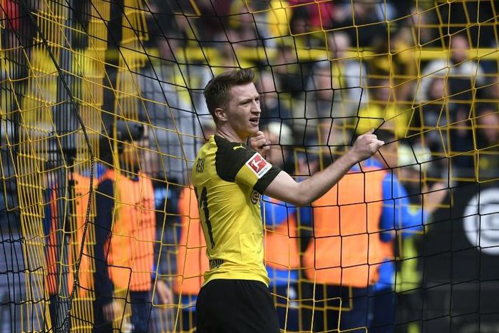 Marco Reus was sent off as Dortmund suffered a critical blow to their title race hopes with a derby defeat on Saturday