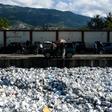 Plastic waste is seen floating on a sewage canal in the Haitian capital Port-au-Prince, on April 23, 2019. Around 180 governments Have agreed on a new UN accord to regulate the export of plastic waste