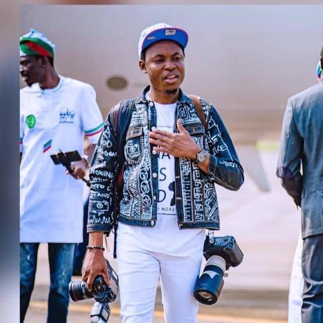 The official photographer of President Muhammadu Buhari, Mr Bayo Omoboriowo [Twitter/@tolanialli]