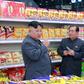 This undated picture released by North Korea's official Korean Central News Agency (KCNA) shows North Korean leader Kim Jong Un (L) visiting a department store