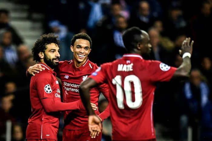 Liverpool players celebrate after Mohamed Salah's goal in their 4-1 win away to FC Porto that took them through to the Champions League semi-finals