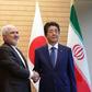 Iranian Foreign Minister Mohammad Javad Zarif (L), seen here with Japan's PM Shinzo Abe, is set to visit China Friday for talks on "regional and international issues," state news agency IRNA reports