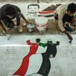 Sudanese protesters paint a mural during a sit-in outside the army headquarters in the capital Khartoum on April 28, 2019