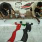 Sudanese protesters paint a mural during a sit-in outside the army headquarters in the capital Khartoum on April 28, 2019