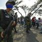 Soldiers identify themselves as supporters of Venezuelan opposition leader Juan Guaido with blue sashes