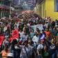 Thousands of Hondurans marched through the capital to protest against new laws they say will lead to mass layoffs
