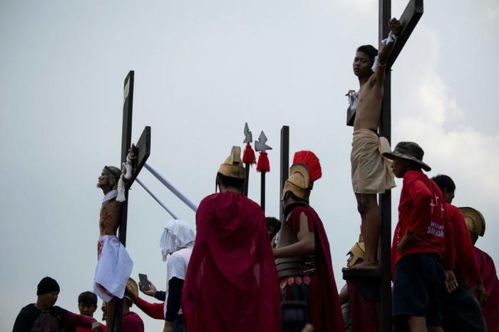 Every Good Friday several men are nailed to a cross in a re-enactment of the crucifixtion of Jesus Christ to atone for sins or seek divine intercession