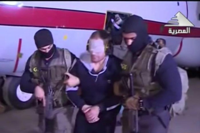 Egyptian state television broadcast footage of wanted jihadist Hisham Ashmawy being escorted off a plane in Cairo by intelligence agents