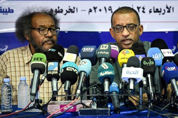 Sudanese civil society activists Muawia Shaddad (L) and Omar el-Digeir (R), two of the leaders of the protest movement the Alliance for Freedom and Change