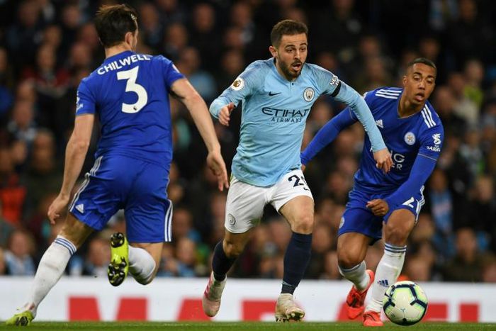 Treble chance - Manchester City's Bernardo Silva (C) in action against Leicester