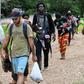 Haitian migrants arrive in Lajas Blancas, Darien province, Panama, on May 22, 2019, after walking through the jungle