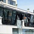 Two men inspect damage from the roof of a restaurant at the Kingsbury Hotel in Colombo on April 22, 2019, a day after it was hit during a series of bomb blasts targeting churches and luxury hotels in Sri Lanka