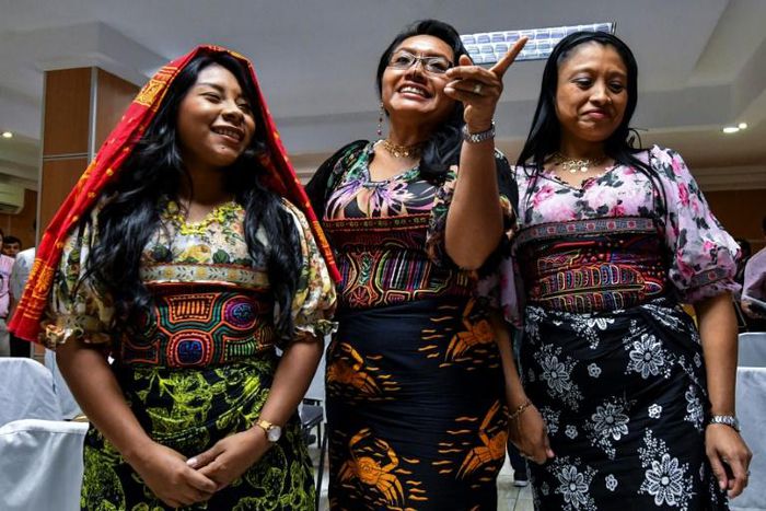 Guna indigenous women from Panama wearing traditional Mola designs at a press conference in Panama City to raise awareness of their intellectual property case against US Sportswear giant Nike