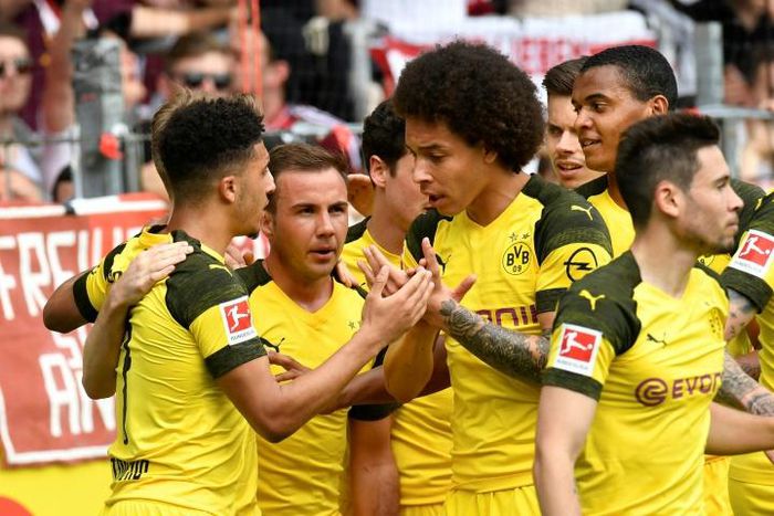 Axel Witsel (C) has kept a watchful eye on English talent Jadon Sancho (L) this season