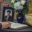 A mourner signs a guest book in June 2017 during the funeral for Otto Warmbier, who was imprisoned after being accused of taking down a propaganda poster in his hotel during a tour trip to North Korea