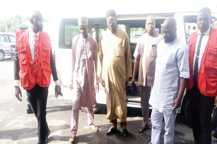 Abubakar Ishiak, Permanent Secretary, Kwara Government House and the three other accused officials being led to court by officers of the Economic and Financial Crimes Commission (EFCC) [Independent]