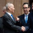 Chinese Vice Premier Liu He (L) shakes hands with US Trade Representative Robert Lighthizer (R) alongside US Treasury Secretary Steven Mnuchin (C) following two hours of negotiations