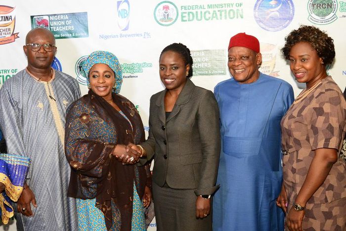L-R; The President, All Nigeria Confederation of Principals of Secondary Schools (ANCOPSS), Principal Anselm Izuagie; Director, Basic & Secondary Education, Federal Ministry of Education, Dr. Lami Amodu; Corporate Affairs Director, Nigerian Breweries P...
