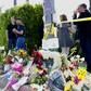 Mourners and well wishers leave flowers at a makeshift memorial across the street from the Chabad of Poway Synagogue on Sunday, April 28, 2019 in Poway, California, one day after a teenage gunman opened fire, killing one person and injuring three