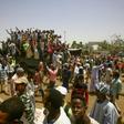 Sudanese protesters gather near the military headquarters in the capital Khartoum
