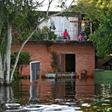 Some residents living close to the Paraguay River have had to move into the upper floors of their homes to escape the rising floodwaters