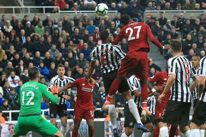 Divock Origi heads home Liverpool's winner in a 3-2 victory at Newcastle
