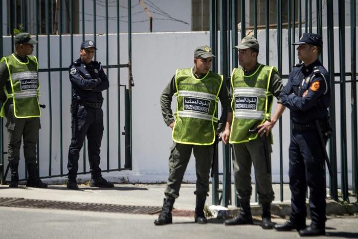Moroccan security forces standing guard during Thursday's trial in Sale, near Rabat