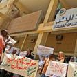 Sudanese journalists take part in a demonstration outside the information ministry
