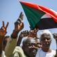 Sudanese protesters chant slogans, flash V-for-victory signs and wave the national flag at the sit-in outside the army headquarters in the capital Khartoum on May 14, 2019