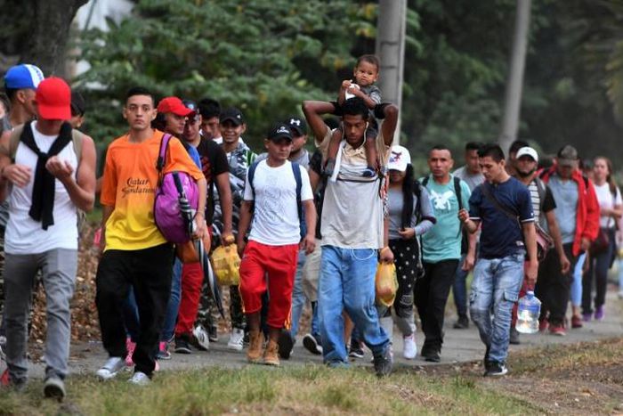 In this file photo taken on April 10, 2019, Honduran migrants hoping to reach the United States leave San Pedro Sula, 300 kms north of Tegucigalpa, to travel to the Guatemalan border