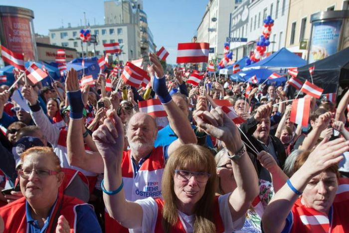 Hundreds of FPOe supporters rallied in Vienna waving party flags ahead of EU elections