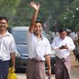 Reuters journalist Kyaw Soe Oo waves as he and Wa Lone walk out of Insein prison