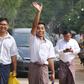 Reuters journalist Kyaw Soe Oo waves as he and Wa Lone walk out of Insein prison