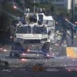 Forces loyal to President Nicolas Maduro confront supporters of opposition leader Juan Guaido