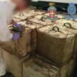 A video grab made available by the Spanish Guardia Civil showing packs of hashish seized during the raids