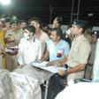 Gujarat Chief Minister Vijaybhai Rupani stands near the bodies of students who died in the fire in Surat