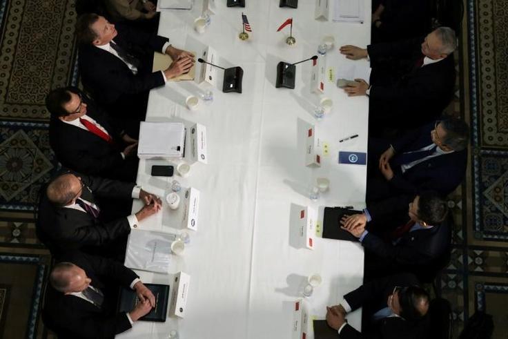 US Treasury Secretary Steven Mnuchin (Center L, pictured February 2019) talks with Chinese Vice Premier Liu He (top R) for trade negotiations, which are approaching a possible make-or-break moment