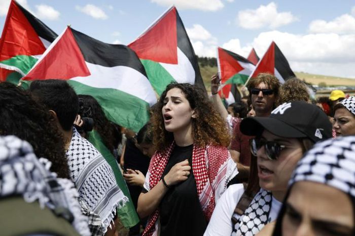 Demonstrators carried Palestinian flags and sang the Palestinian anthem in the town of Umm al-Fahm