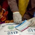 A Pakistani paramedic takes blood samples from a child for a HIV test in Larkana. Nearly 700 people, many of them children, have tested positive in recent weeks