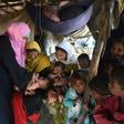 A Pakistani health worker administers drops to a child during a polio vaccination campaign in Lahore